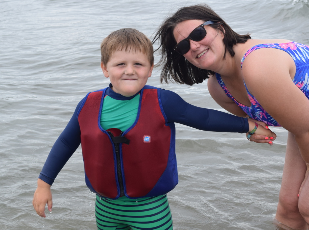 H posing at the beach